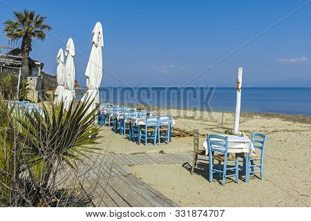 Nea Fokea, Kassandra,  Greece - March 31, 2019: Typical Greek Restaurant At The Beach Of Nea Fokea, 