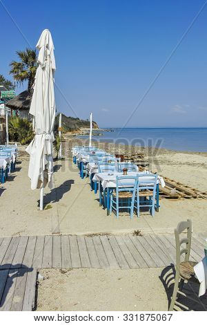 Nea Fokea, Kassandra,  Greece - March 31, 2019: Typical Greek Restaurant At The Beach Of Nea Fokea, 