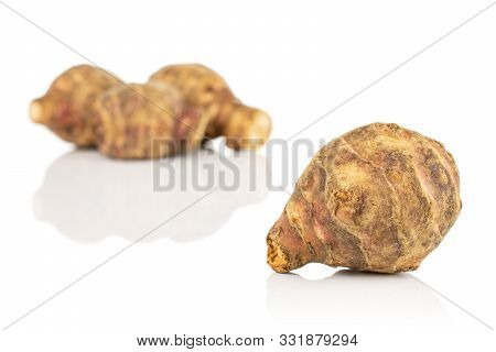 Group Of Four Whole Fresh Brown Jerusalem Artichoke Front Focus Isolated On White Background