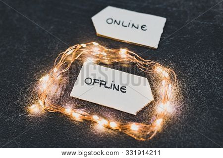 Social Media Lifestyle Concept, Online And Offline Alternatives On Signs Pointing At Opposite Direct