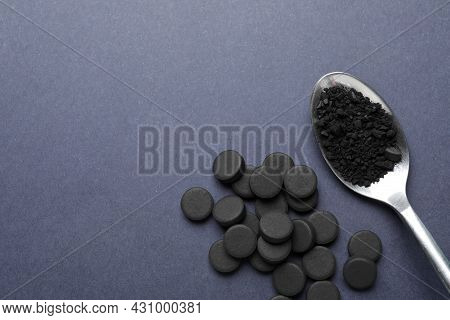 Activated Charcoal Pills On Grey Background, Flat Lay With Space For Text. Potent Sorbent