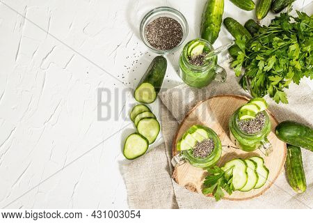 Green Smoothie With Cucumber In A Glass Jar. Fresh Ripe Vegetables, Greens, And Chia Seeds