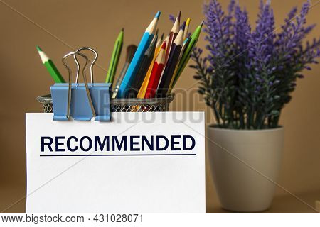 Recomended - Word On A White Sheet Against The Background Of Pencils And A Bouquet Of Lavender. Educ