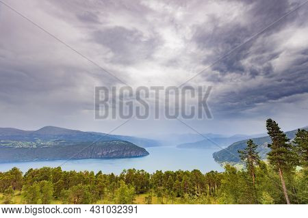 Norwegian Landscape. Green Mountains Hills And Fjord, Stormy Rainy Weather.