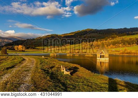 autumn pond under the mountains, Murau district,
Styria, Austria