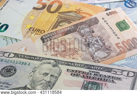 Close Up To 5000 Francs Of The Republic Of Congo Between 50 Us Dollar And 50 Euro Banknotes. Five Th