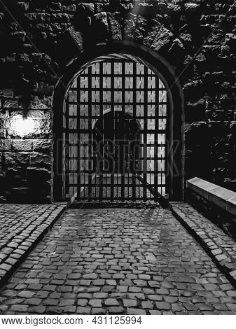 B&w Photo Of A Gateway Entrance To A Medieval Complex In Nyc During Night Time.