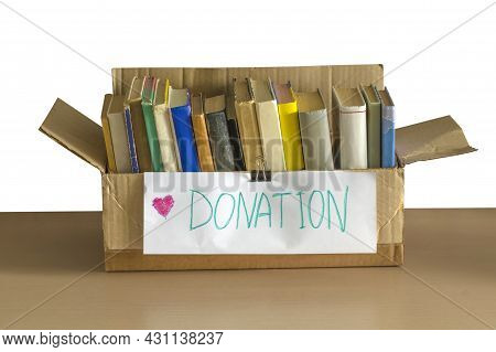 Cardboard Donation Box Full Of Books. Donation Concept. Help For Children, Support For Poor Kid. Soc