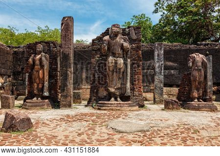 Stainding Buddha statue in ancient ruins. So-called Quadrangle, ancient city Polonnaruwa - famous tourist destination and archaelogical site, Sri Lanka