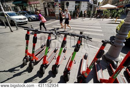 Bucharest, Romania - August 19, 2021: Several Lime-s Electric Scooters Are Parked On A Sidewalk Near