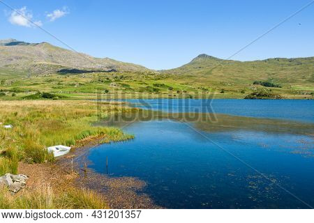 Snowdonia, Wales, Llyn Y Gader. Beautiful Lake By Beddgelert Forest. Tranquil Mountain Scene On A Su