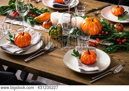 Autumn Table Setting With Plate, Pumpkin And Candles.