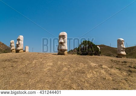 The Republic Of Crimea. July 11, 2021. Stone Heads Sticking Out Of The Ground Near Mount Alchak In S