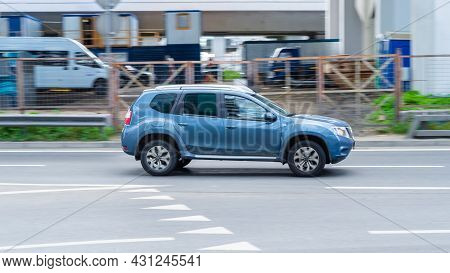 Moscow, Russia - August 2021: Very Fast Dangerous Driving Car On Road. Blue Nissan Terrano Rebadged 