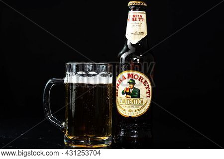 Can Of Birra Morreti Beer And Beer Glass On Dark Background. Illustrative Editorial Photo Shot In Bu