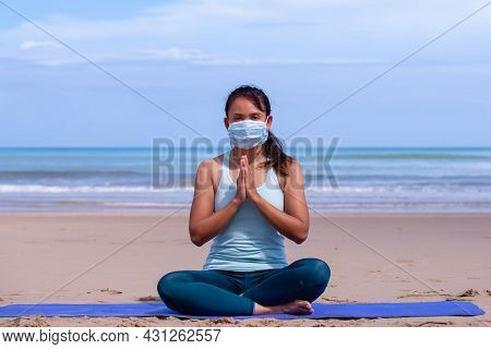 People, Fitness, Sport And Healthy Lifestyle Concept - Young Asian Girl Making Maditation In Medical
