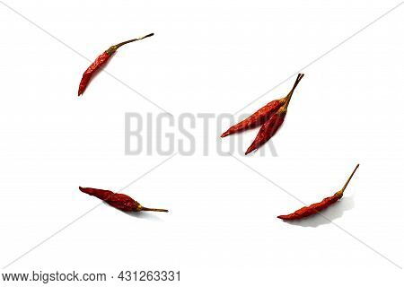 Dry Red Hot Chili Peppers On White Background