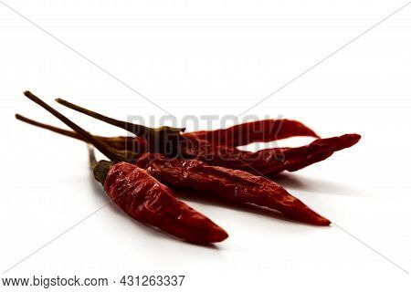 Dry Red Hot Chili Peppers On White Background