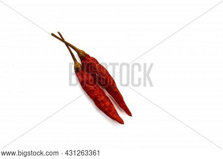 Dry Red Hot Chili Peppers On White Background