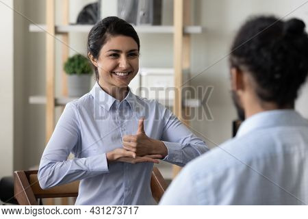 Happy Young Indian Woman Practicing Sign Language With African Friend.