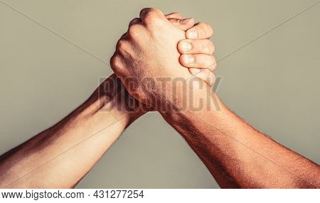 Man Hand. Two Men Arm Wrestling. Arms Wrestling. Closep Up. Friendly Handshake, Friends Greeting, Te
