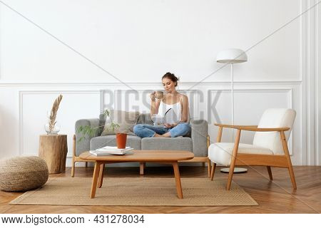 Woman relaxing in a minimal home