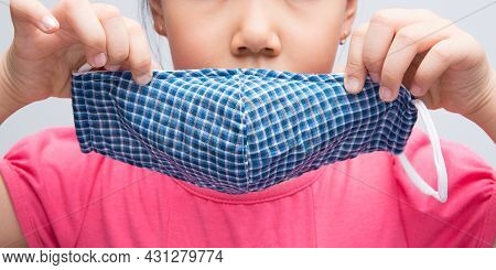 The Mask Is Made Of White Anti-virus Fabric In A White Background.