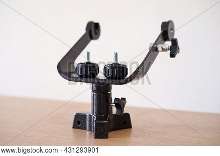 Yoke Altazimuth Mount, Thumb Screw, And Vertical Fine Adjustment Rod. Telescope Parts On Wooden Tabl