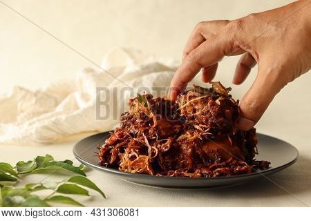 Kerala Style Spicy Chicken Roast Garnised With Caramalised Onions. Popular Name Is Kozhi Varuthathu.