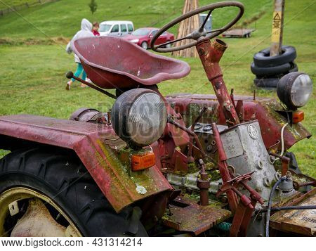 Valea Rece, Romania- 29 August 2021: Old , Abandoned Tractor On The Field, Focus On The Headlight.