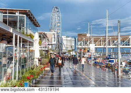 Limassol, Cyprus - December 30, 2019: People Walking In Limassol Marina After Rain