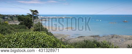 Sea And Harbor With Sailing Boats In Atlantic Ocean Near St Brieuc In French Brittany Under Blue Sum