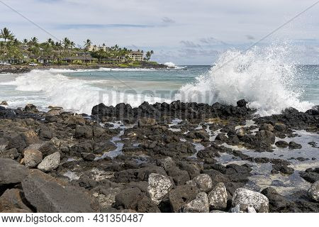 Rough Ocean Waves Break On The Rocky Shore Of Poipu Beach Park In Poipu, Hawaii.