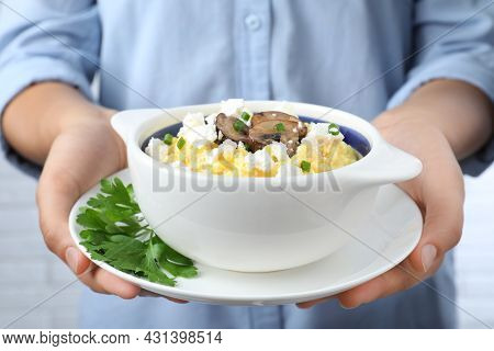Woman With Traditional Banosh On Light Background, Closeup