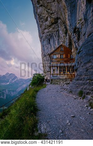 Swiss Alps And A Mountain Restaurant Under The Aescher Cliff Viewed From Mountain Ebenalp In The App