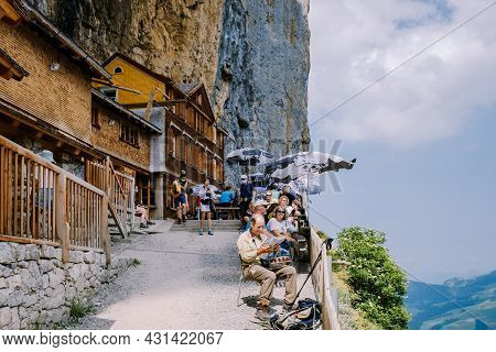 Swiss Alps And A Mountain Restaurant Under The Aescher Cliff Viewed From Mountain Ebenalp In The App