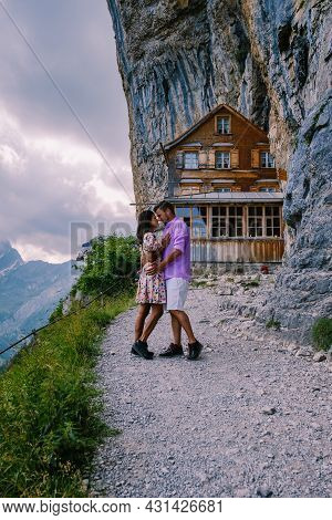 Swiss Alps And A Mountain Restaurant Under The Aescher Cliff Viewed From Mountain Ebenalp In The App