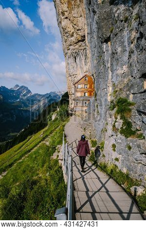 Swiss Alps And A Mountain Restaurant Under The Aescher Cliff Viewed From Mountain Ebenalp In The App