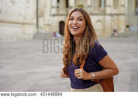 Brazilian Female Tourist Laughing Outdoors. Beautiful Traveler Girl Joyful On Her Jouney In Europe.
