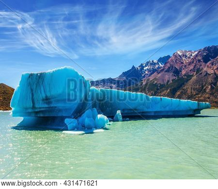 Lake Viedma, Argentine Patagonia.  Huge white-blue iceberg floating in the warm summer sun