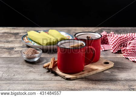 Traditional Mexican Chocolate Atole Drink On Wooden Table
