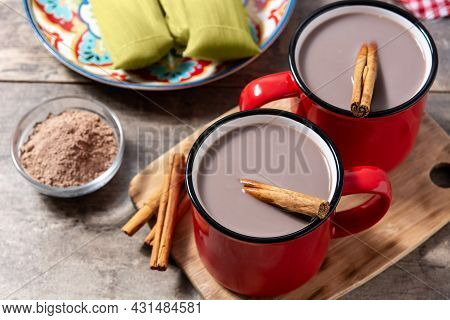 Traditional Mexican Chocolate Atole Drink On Wooden Table