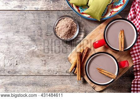 Traditional Mexican Chocolate Atole Drink On Wooden Table. Top View. Copy Space