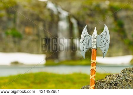 Equipment Of Viking Or Barbarian Warrior Outdoor On Nature. Viking Axe Against Norwegian Nature. Tou