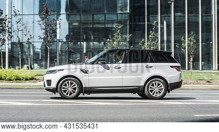 Car Range Rover Sport In The Motion On Highway Road. Moscow, Russia - July 2021