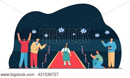 Paparazzi Taking Photos Of Girl In Crown Standing On Red Carpet. Young Celebrity Or Actress And Male