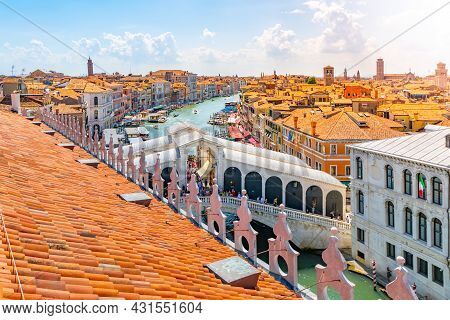 Rialto Bridge Above Grand Canal. View From Rooftop Lookout Terrace Of The Fondaco Dei Tedeschi. Veni