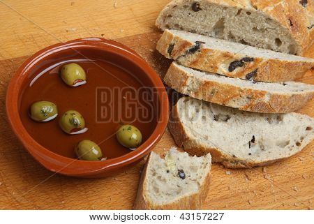 Artisan olive bread with olive oil.