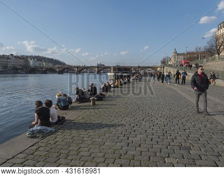 Prague, Czech Republic, March 26, 2021: The Embankment Of River Vltava Called Naplavka, With Crowd O