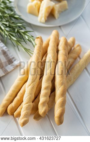 Grissini sticks. Traditional italian bread sticks on white table.